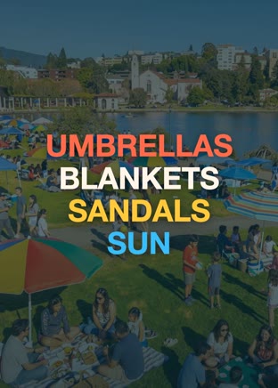 Friends picnicking under umbrellas on the lawn at Lake Merritt